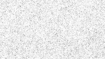 Random black dot grain texture on white background. Abstract stipple pattern for grunge overlay or subtle design element. Noise effect backdrop.