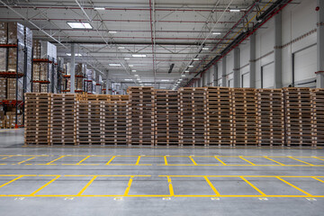 Stacked Wooden Pallets in a Large Warehouse Storage Area