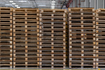 Stacked Wooden Pallets in a Large Warehouse Storage Area