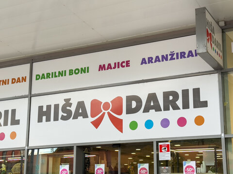 Ljubljana, Slovenia - October 02, 2025: Colorful storefront of Hisa Daril, a gift shop featuring vibrant signage and a welcoming entrance, inviting customers to explore unique items