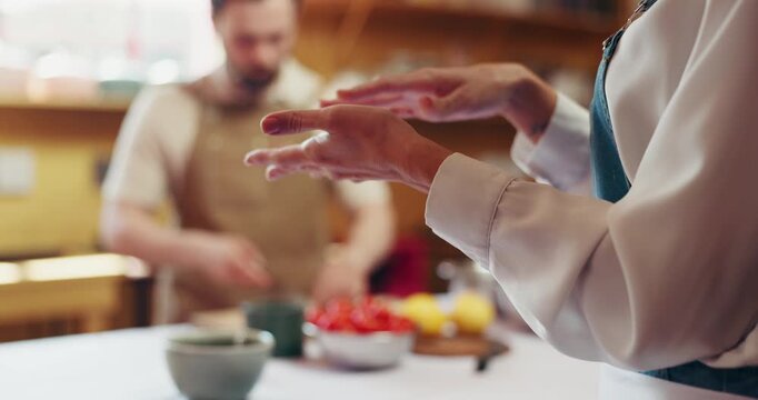 Cooking, hands and chef explain in class for meal prep, learning process and food instructions. Culinary education, people and masterclass in kitchen with cuisine guidance and technique demonstration