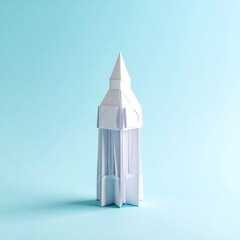 White paper tower on light blue