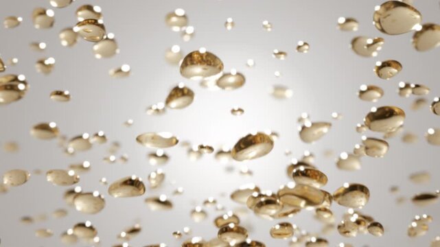 Golden oil or collagen droplets float in liquid. Omega fatty acids or retinol bubbles. Concept luxury skincare cosmetics, anti-aging treatments and moisturizing beauty products. Premium cosmetic