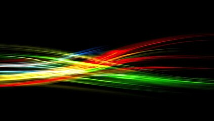 Abstract art with multicolored light streaks on a black background, conveying movement