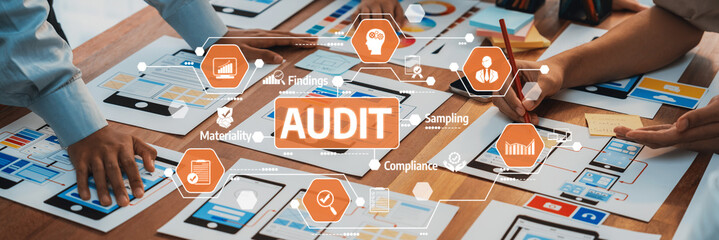 A dynamic scene of professionals engaged in an audit session, showcasing teamwork and strategic planning while analyzing digital screens and documents. Amity