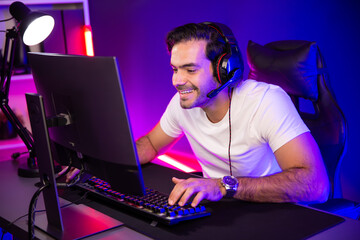 Smart gaming streamer talking with team member players using headset and mic for communicate with...