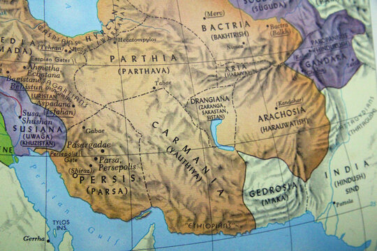 A close-up of an antique-style map detailing the historical region of the Persian Empire and Central Asia. It highlights ancient territories like Parthia, Persis, Bactria, Gandara, and Carmania, focus