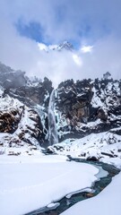 Winter waterfall scene in a mountain valley