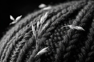 Monochrome Close-up - Delicate Dried Grass on Cozy Knitted Fabric, Highlighting Rustic Texture and Serene Contrast.