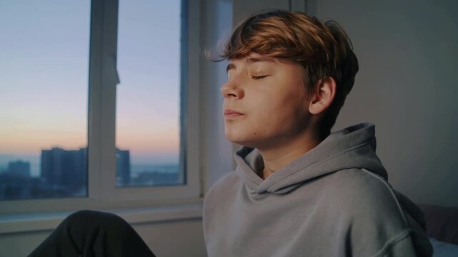 Serene moment by the window at sunset