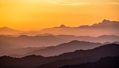 Layered Mountain Range at Golden Sunset with Hazy Silhouette and Warm Colors a Horizontal Scenery in Shades of Orange Purple and Dark Blue