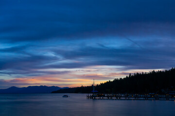 A dramatic marbled dusk sky over the tranquil Lake Tahoe, in California