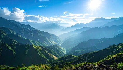 Fototapeta premium Lush Green Mountain Range Under Bright Sunlight and Clear Blue Sky Scenery with Distant Peaks and Mist in Daytime Scenic Landscape