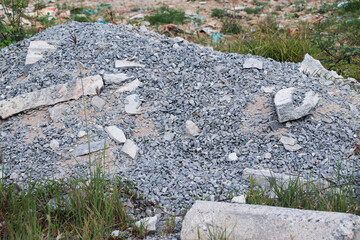 Uneven gravel surface showing scattered small stones and broken rock pieces