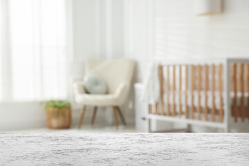Baby room with empty white table. Space for design