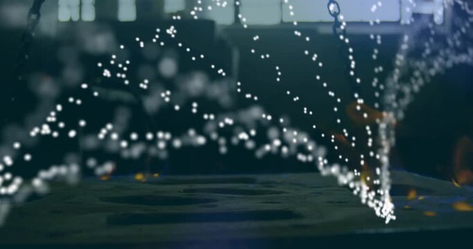 Glowing forge fire pulsing, releasing sparks, forming dynamic parabolic arcs over steel platform