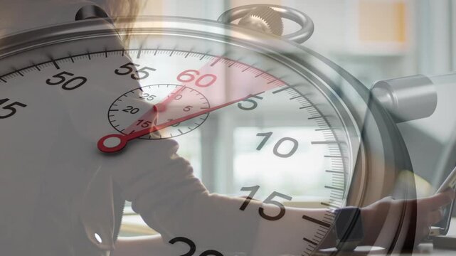 Stopwatch appearing at 58s mark initiating woman leaning forward typing on laptop showing tech time