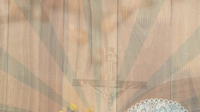 Showing wooden planks glowing in light for altar, crucifix centering over doily, spheres resting