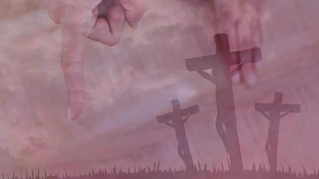 Index finger entering frame and descending over three wooden crosses showing graveyard silhouette