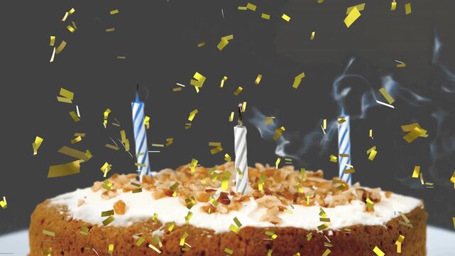 Confetti drifting around three candles on cake causing candle going out smoke spiraling celebrating