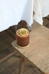 Tropical iced lemonade coffee on wooden table. Homemade cold summer Refreshing healthy drink.
