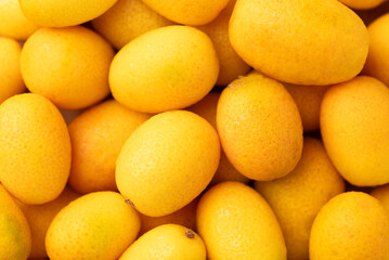 Fresh kumquats fruit texture background