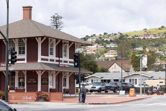 Cloudy afternoon sun shines on historic buildings in the heart of downtown Santa Paula, California, USA.