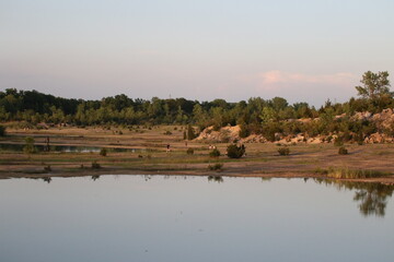 landscape photo of pond at sunset