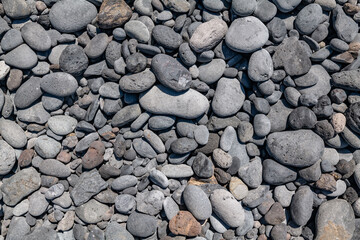 Basalt pebbles.  Wai‘Ōpae Gulch, Hawaii Route 31 / Pi'ilani Highway, island of Maui, Hawaii. Haleakalā / East Maui Volcano, is a shield volcano.