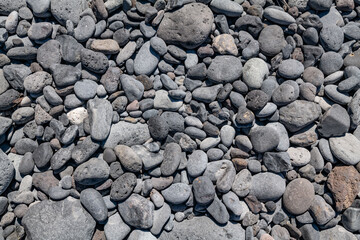 Basalt pebbles.  Wai‘Ōpae Gulch, Hawaii Route 31 / Pi'ilani Highway, island of Maui, Hawaii. Haleakalā / East Maui Volcano, is a shield volcano.