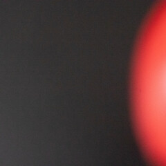 Red noisy Circular Glow on Dark Background