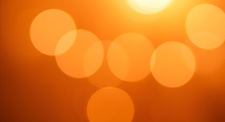 Warm Orange Bokeh Circles Created by Sunlight on a Soft Background for a Calming Atmosphere