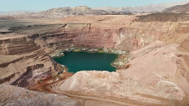 4K Drone Orbit from Right to Left Around the Hidden Lake in Timna Park, Eilat, Israel &ndash; Desert Aerial Landscape