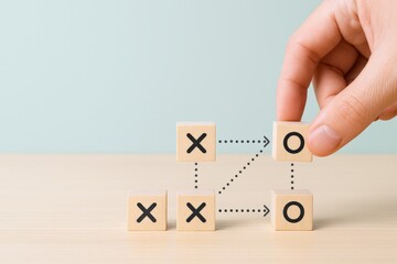 Tic-Tac-Toe Game Strategy with Wooden Blocks and Hand Placement for Business or Education Concepts