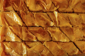 Closeup of a tray of flaky homemade baklava
