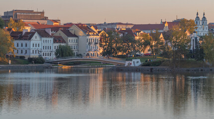 Fototapeta premium Golden autumn in Minsk by the river. Belarus.