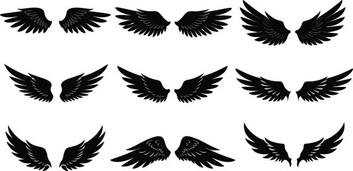 A vector illustration set of black eagle wings in silhouette, symbolizing freedom and flight