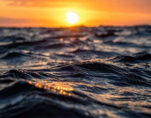 Ocean waves at golden sunset light