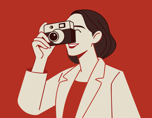Stylish Woman Capturing Moment with Retro Film Camera on Terracotta Background