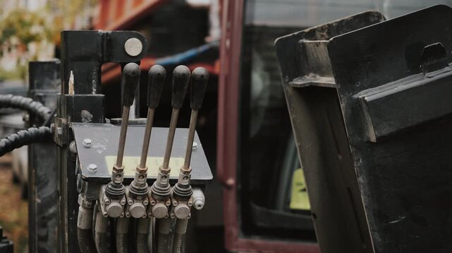 A close-up of the joystick controls. Heavy construction equipment controls. Horizontal drilling machine control.