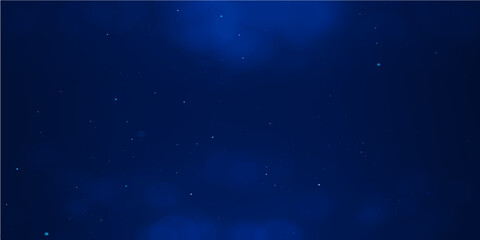 Dark blue abstract galaxy with twinkling stars and snow particles creating a night sky or underwater motion effect