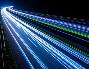 Blue and Green Light Streaks on a Dark Highway