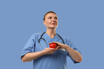 Medical worker encourages nutrition awareness holding an apple