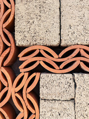 Abstract pattern of concrete blocks and terracotta bricks