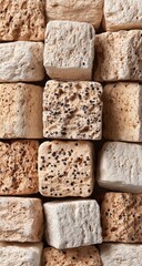 Close-up view of textured, square stones.