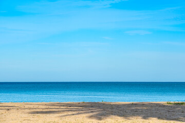 Nature of the ocean and blue sky Summer with sunshine, sandy beaches, clear blue waters sparkling against the blue sky. on an island with good ecology and environment Background for summer vacation