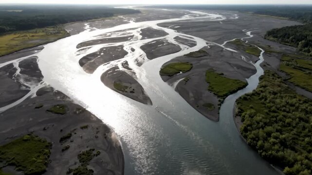 Sweeping aerial drone shot of intricate braided river system