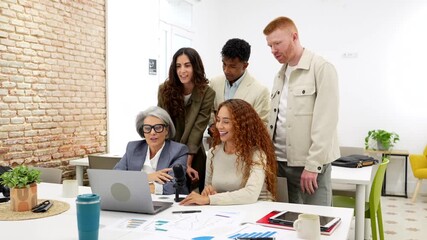 Diverse business team collaborating on project in modern office meeting - Powered by Adobe