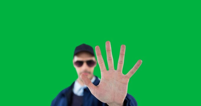 Animation of blurred caucasian policeman gesturing stop on transparent background