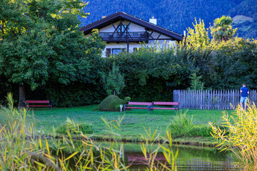 Burglehen Park with pond and turtle flower figure in Tirolo (Dorf Tirol), South Tyrol, Italy